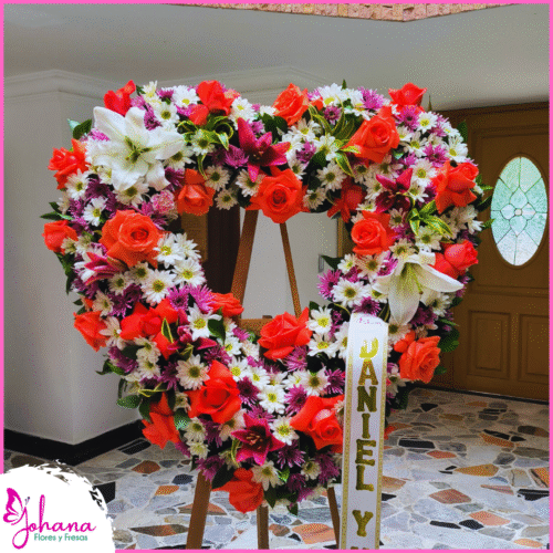Corona fúnebre corazón mixto con rosas, lirios y margaritas